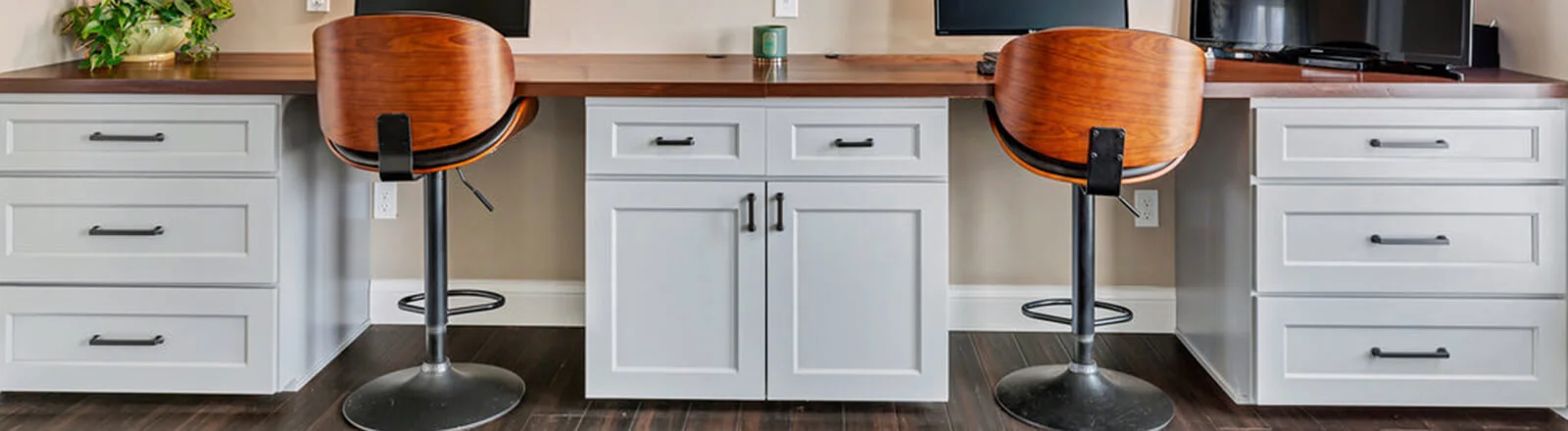 White built-in cabinetry with a wood worktop